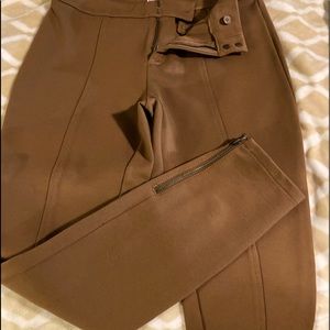 Pants, zipper on legs, straight leg.